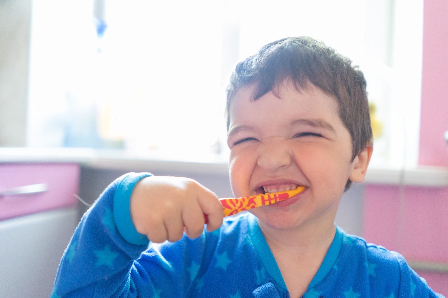 A child brushing their teeth as part of a visible daily habits routine