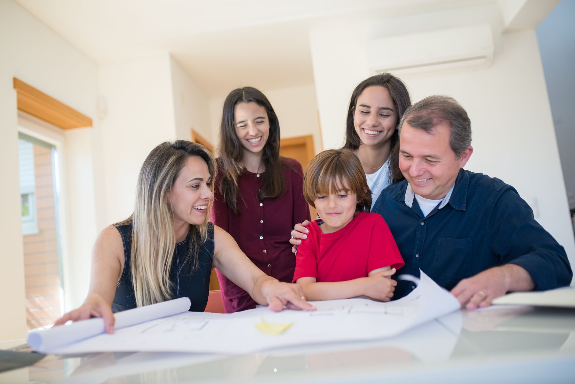 A family reviewing a weekly routine and responsibility plan together
