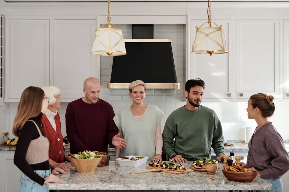 A whole family together in the kitchen, from kids to grandparents